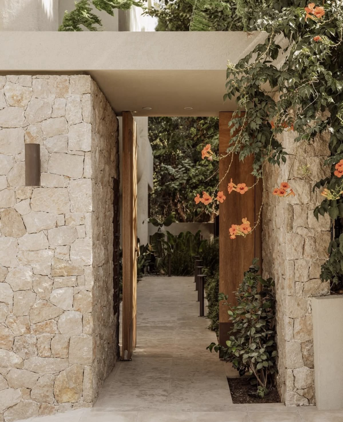 Stone entrance with flowering vine